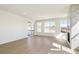 Open-concept living space featuring hardwood floors, a modern fireplace, and sliding door access to the deck at 4371 Soapberry Pl, Castle Rock, CO 80108