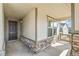 Inviting covered porch with stylish stone accents, a side lite window, and a cozy outdoor ambiance at 4371 Soapberry Pl, Castle Rock, CO 80108