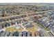 Expansive aerial view of a well-planned community with diverse housing and street layouts at 15842 E Warner Dr, Denver, CO 80239
