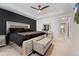 Main bedroom with king-size bed and access to the hallway at 15842 E Warner Dr, Denver, CO 80239