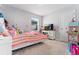 Bright bedroom with striped bedding and plenty of storage at 15842 E Warner Dr, Denver, CO 80239