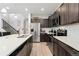 Modern kitchen with stainless steel appliances and an island at 15842 E Warner Dr, Denver, CO 80239