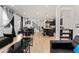 Open concept kitchen with island, stainless steel appliances, and dark cabinets at 15842 E Warner Dr, Denver, CO 80239