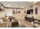 Basement featuring a fireplace, sports memorabilia, hard wood floors, and a dog bed at 4316 S Netherland St, Aurora, CO 80015