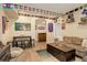Basement featuring a wet bar, a couch, fun sports memorabilia, and hard wood floors at 4316 S Netherland St, Aurora, CO 80015