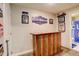 Finished basement bar with sports decor, including a wet bar, bathroom, and finished flooring at 4316 S Netherland St, Aurora, CO 80015