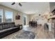 Spacious living area with sliding door access to the outdoors, a dining area, and a breakfast bar at 4316 S Netherland St, Aurora, CO 80015