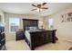 Main bedroom showcasing a large bed, side tables, and ample natural light at 4316 S Netherland St, Aurora, CO 80015