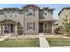 Charming two-story townhouse showcasing a well-maintained lawn and inviting facade with a welcoming walkway at 4358 S Nepal Ct, Centennial, CO 80015