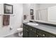 Stylish bathroom features a sleek vanity with dark cabinets and modern fixtures at 5677 S Park Pl # A102, Englewood, CO 80111