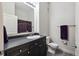 Clean bathroom featuring a vanity with dark cabinets at 5677 S Park Pl # A102, Englewood, CO 80111