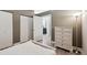Bedroom featuring hardwood floors, large closets, and ensuite bathroom at 5677 S Park Pl # A102, Englewood, CO 80111