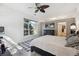 Bedroom with large window, fan and exercise bike at 5677 S Park Pl # A102, Englewood, CO 80111
