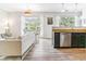 Inviting living space with open layout, a dining area, and a sleek kitchen with stainless steel appliances at 5677 S Park Pl # A102, Englewood, CO 80111