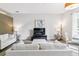 Comfortable living area with stylish decor, a large television, and a dining table creating a welcoming atmosphere at 5677 S Park Pl # A102, Englewood, CO 80111
