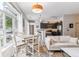 Bright living room with a dining table, modern furnishings, and large windows for natural light at 5677 S Park Pl # A102, Englewood, CO 80111