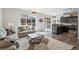 Open-concept living room flows into kitchen area with lots of light and views to the exterior patio at 5677 S Park Pl # A102, Englewood, CO 80111