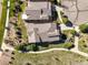 Aerial shot showcasing a property's tile roof, landscaping, and proximity to walking trails at 2373 S Joyce St, Denver, CO 80228