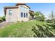 Backyard view showcases a manicured lawn and the home's exterior at 2373 S Joyce St, Denver, CO 80228