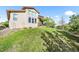 View of a well-maintained home backyard with a green lawn and a patio at 2373 S Joyce St, Denver, CO 80228