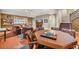 Basement featuring a large game table, comfy seating, and staircase access to the upper level at 2373 S Joyce St, Denver, CO 80228