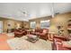 Comfortable basement area with a leather sofa, desk space, and an exercise area for versatile use at 2373 S Joyce St, Denver, CO 80228