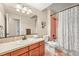 Bathroom showcasing a vanity with a sink, toilet, and shower with bathtub at 2373 S Joyce St, Denver, CO 80228