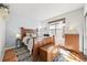 Cozy bedroom with hardwood floors, natural light, and a stylish area rug at 2373 S Joyce St, Denver, CO 80228