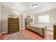 Cozy bedroom featuring a twin bed, wood furniture, and a window with natural light at 2373 S Joyce St, Denver, CO 80228