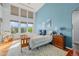 Bright bedroom with vaulted ceilings, large windows, and mountain views at 2373 S Joyce St, Denver, CO 80228