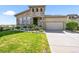 Charming stone accented two-story home with well-maintained lawn and attached two-car garage at 2373 S Joyce St, Denver, CO 80228