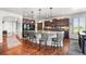 Beautiful kitchen with dark wood cabinets, granite countertops, and stainless steel appliances at 2373 S Joyce St, Denver, CO 80228