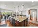 Spacious kitchen with large island, granite countertops, and stainless steel appliances at 2373 S Joyce St, Denver, CO 80228