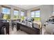Bright home office with multiple windows and a view of the outdoors at 2373 S Joyce St, Denver, CO 80228