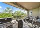 Outdoor patio with built-in grill and comfortable seating area with views at 2373 S Joyce St, Denver, CO 80228