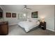 Cozy bedroom features great natural light, ceiling fan, and neutral décor and carpet at 5382 S Pine Rd, Evergreen, CO 80439