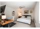 Comfortable bedroom with a ceiling fan, desk, and ample space, perfect for relaxing or working at 5382 S Pine Rd, Evergreen, CO 80439