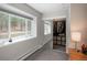 Bedroom featuring a large window offering scenic views and a mirrored closet for ample storage at 5382 S Pine Rd, Evergreen, CO 80439