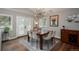 Inviting dining room with modern chandelier, natural light, and access to outdoor space with a view at 5382 S Pine Rd, Evergreen, CO 80439