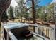Relaxing hot tub with scenic views, nestled amongst a tranquil wooded landscape at 5382 S Pine Rd, Evergreen, CO 80439