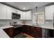 Modern kitchen features stainless steel appliances, stylish cabinetry, and sleek countertops and fixtures at 5382 S Pine Rd, Evergreen, CO 80439
