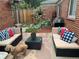 Cozy backyard patio features outdoor seating, grill, and charming garden area at 5018 E 8Th Ave, Denver, CO 80220