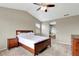 Cozy bedroom featuring carpeted floors and adjoining bathroom at 471 N Jackson Gap Way, Aurora, CO 80018