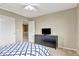 This bedroom features a ceiling fan, natural light, and storage at 471 N Jackson Gap Way, Aurora, CO 80018