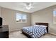 The bedroom features a ceiling fan, and natural light at 471 N Jackson Gap Way, Aurora, CO 80018