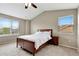 Bedroom with a wooden bed, carpet, and two windows provides lots of natural light at 471 N Jackson Gap Way, Aurora, CO 80018