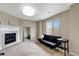 Spacious living room featuring a fireplace and large mirror at 471 N Jackson Gap Way, Aurora, CO 80018