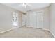 This bedroom features neutral walls and carpet, a ceiling fan, and double closets at 598 Crossing Cir, Castle Pines, CO 80108