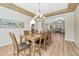 Inviting dining room featuring a spacious dining table and a view into the living area at 598 Crossing Cir, Castle Pines, CO 80108