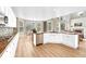 Open concept kitchen with white cabinets, granite countertops, stainless steel appliances, and breakfast nook at 598 Crossing Cir, Castle Pines, CO 80108